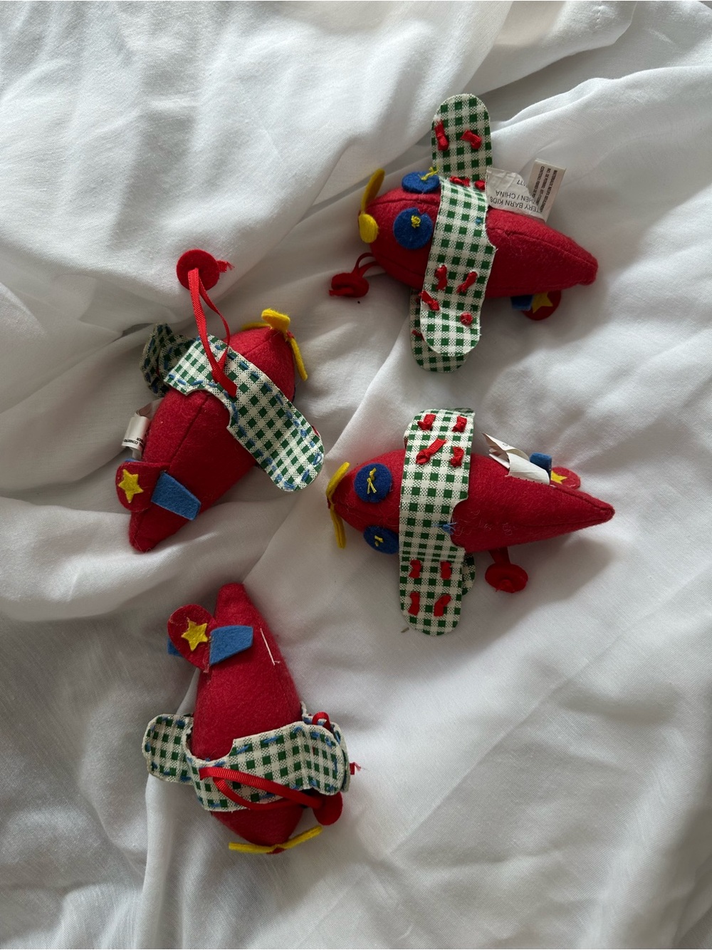 Pottery Barn Kids Red Plush Airplane Ornaments with Green-Checked Wings